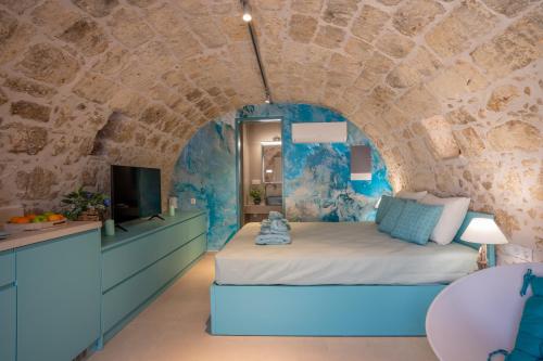 Una cama o camas en una habitación de Kritiki Spilia - Home & Spa