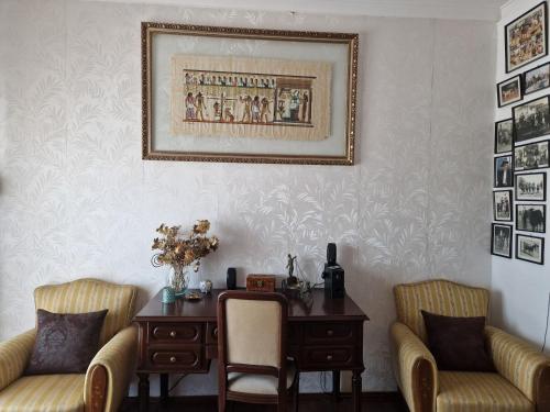 a living room with a table and two chairs at Horse Riding Country House in Vila Franca de Xira
