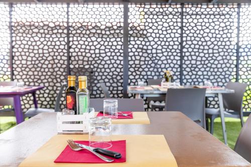 a table with two bottles of wine on it at Locanda dei 4 in Narni