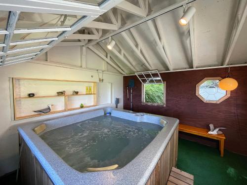 a large tub in the middle of a room at Waterfront Cottages in Lexington Vacation Homes in Lexington