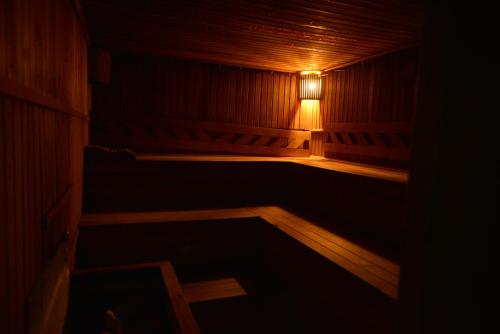a wooden sauna with a light in the dark at Kivrak Hotel in Antalya