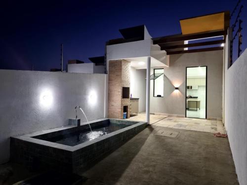 a large bath tub in the middle of a house at 01 - Saint Marie Beach House in Conde