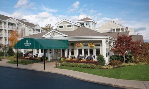 a house with a green awning in front of it at Beautiful Hotel in Nashville 2BD in Nashville