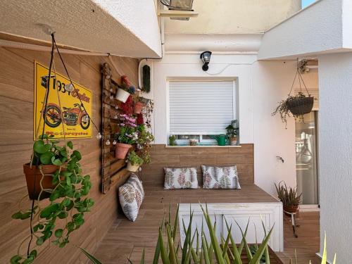 a room with potted plants on the wall at Vivienda turística Jaén Interior ÁTICO in Andújar