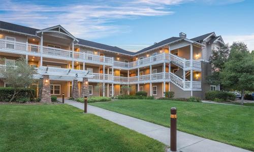 a large building with a lawn in front of it at WorldMark Windsor 2BD in Windsor