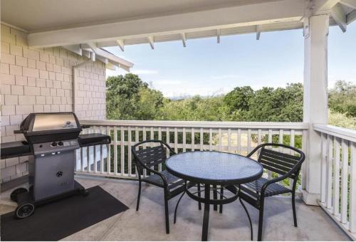a patio with a table and chairs and a grill at WorldMark Windsor 2BD in Windsor