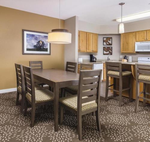 a kitchen and dining room with a table and chairs at WorldMark Windsor 2BD in Windsor