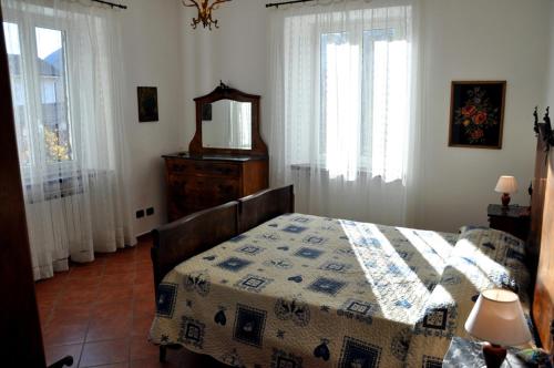 מיטה או מיטות בחדר ב-Tana Degli Orsi