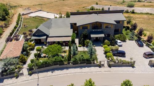 an overhead view of a large house with a parking lot at Casa Gaçe Hotel in Korçë