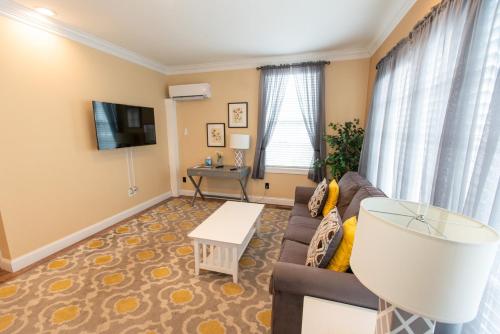 a living room with a couch and a table at Howard's Creek Inn in White Sulphur Springs