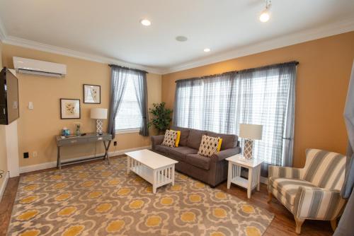 a living room with a couch and a table at Howard's Creek Inn in White Sulphur Springs