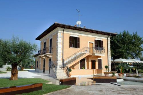 a building with a staircase on the side of it at Villa Tivoli in Guidonia