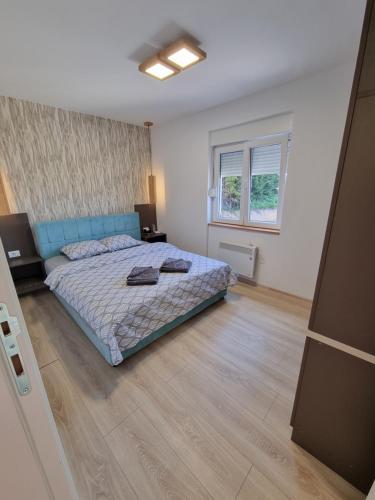 Postel nebo postele na pokoji v ubytování Apartman Mali Raj Zlatar