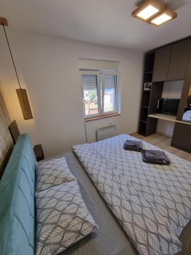 a bedroom with two beds and a large bed at Apartman Mali Raj Zlatar in Nova Varoš