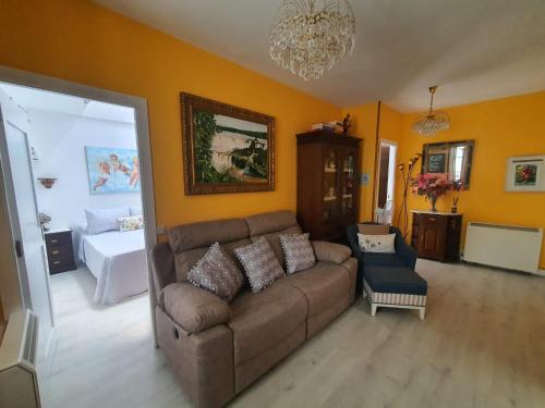 a living room with a couch and a bed at Medieval Gem in Santiago de Compostela