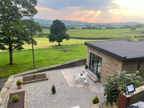 an overhead view of a patio with a table and chairs at Priestleys Retreat in Blackburn