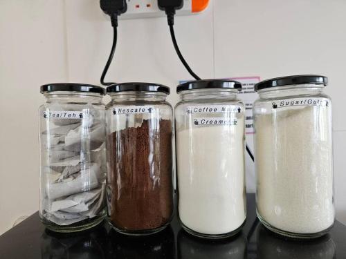 a group of three blenders sitting on top of a counter at Kenyalang Roxy Sematan Homestay in Sematan
