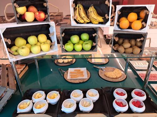 a display of different types of fruits and vegetables at Hotel Puerta Santander in Santander