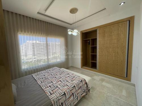 Ένα ή περισσότερα κρεβάτια σε δωμάτιο στο location saisonniere S1 a Sousse