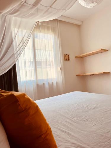 a bedroom with a bed and a window at Family Tree - WATER Available - SELF check in in Golem