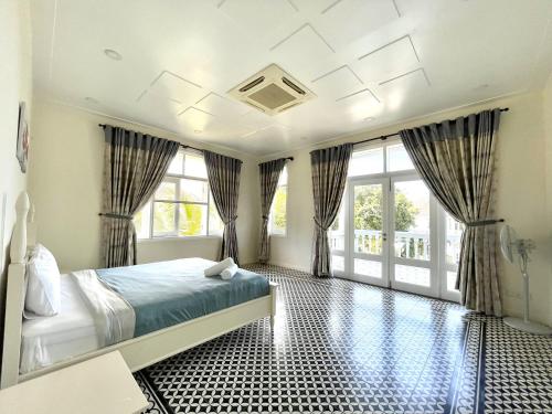 Cama o camas de una habitación en Chang HomeStay Phan Thiết Villa SeaLink&Ocean Vista------------------------------------------------------Căn Hộ Sát Biển-------------Long-Term Rental----------Monthly Rental-------------------------------------------------------GGle CHANG HOMESTAY Mui Ne