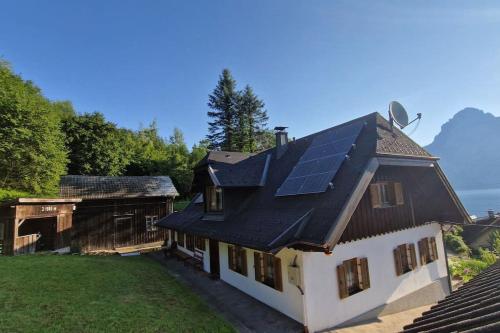 a house with solar panels on the roof at Ferienhaus Beringer am Kallbach in Traunkirchen