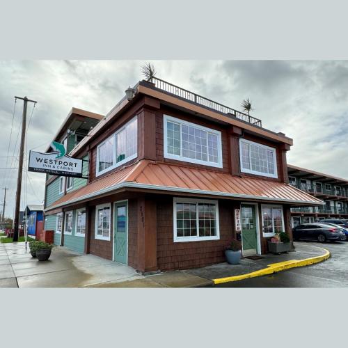 a building on the corner of a street at Westport Inn in Westport