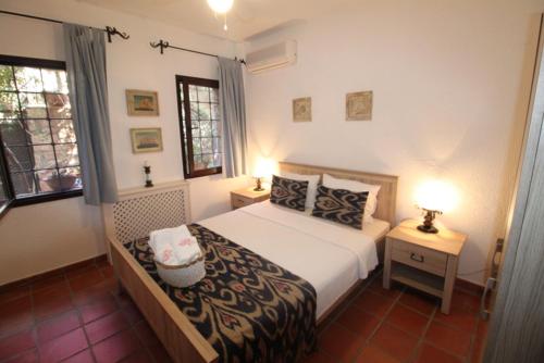 Postel nebo postele na pokoji v ubytování Villa Cosy