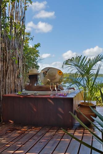 a statue of a man sitting on top of a table at Naara Eco Lodge & Spa in Chidenguele