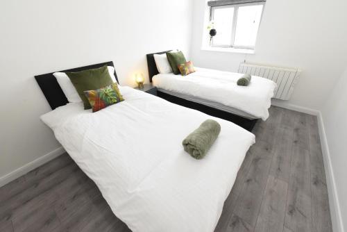 Ένα ή περισσότερα κρεβάτια σε δωμάτιο στο Modern Luxury 2Bed Apartment - City Centre