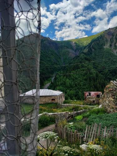 a view of a mountain from behind a fence at guest house "BETQIL" adishi in Adishi