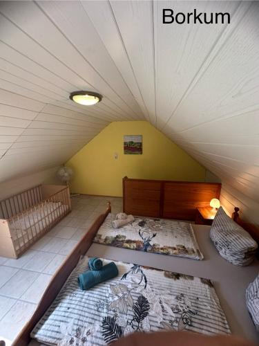 Katil atau katil-katil dalam bilik di Haus Tunix Hunde sind herzlich willkommen
