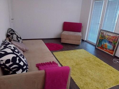 a living room with a couch and a chair at MEDINA in Sarajevo