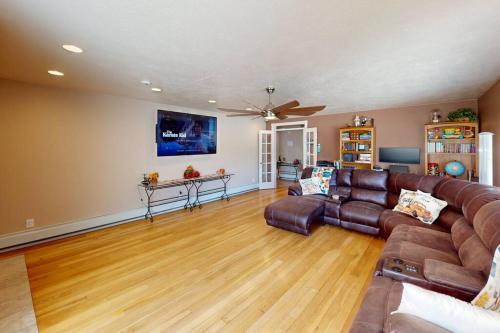 a living room with a couch and a table at Tacit Shadow Resort Aviator Queen Suite, Gym, Coffee Bar, Hot-Tub, Free Laundry, Food Available in Parowan