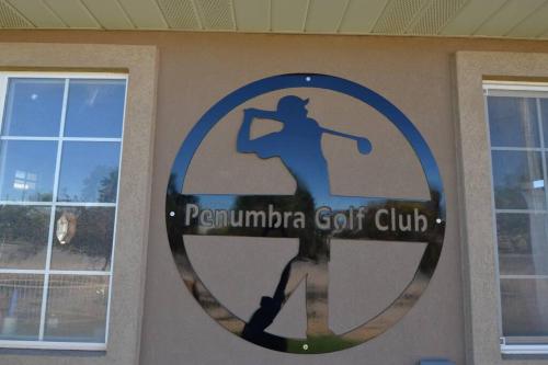 a sign for a golf club on a wall at Tacit Shadow Resort Aviator Queen Suite, Gym, Coffee Bar, Hot-Tub, Free Laundry, Food Available in Parowan