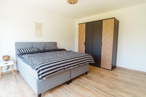 Katil atau katil-katil dalam bilik di Ferienwohnungen CASA TAMALTIO am Moselradweg - Nähe Trier und Luxemburg
