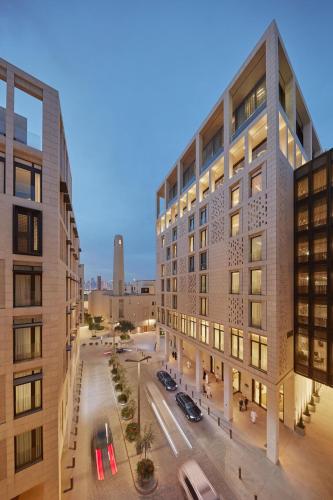 an overhead view of a city street with buildings at Mandarin Oriental, Doha in Doha