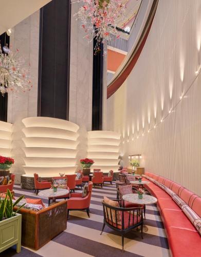 a restaurant with tables and chairs in a building at Mandarin Oriental, Singapore in Singapore