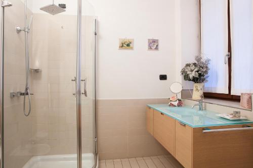 a bathroom with a shower and a sink and a tub at Botton d'Oro Pelabrocco in Bergamo