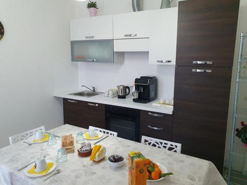 a kitchen with a table with food on it at B&B Il Pozzo dei Desideri in Martellago