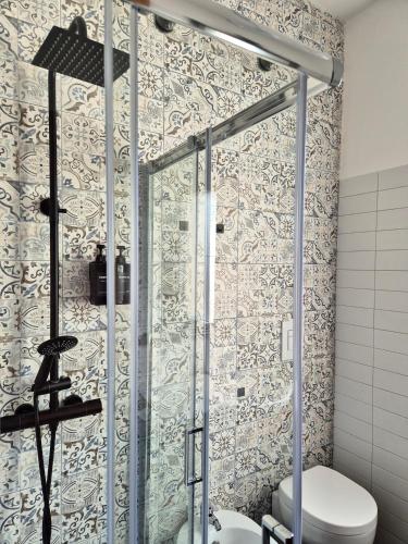 a bathroom with a shower with a toilet at La casa di Athina in Celano