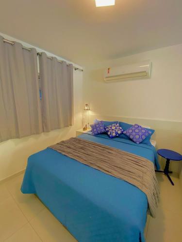 Katil atau katil-katil dalam bilik di Solar Água Apartaments