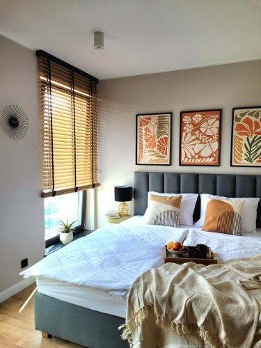 Ένα ή περισσότερα κρεβάτια σε δωμάτιο στο Apartamenty K17 Stare Miasto