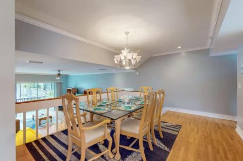 a dining room with a table and chairs at Our House at the Lake House C117 by Beachside in Siesta Key