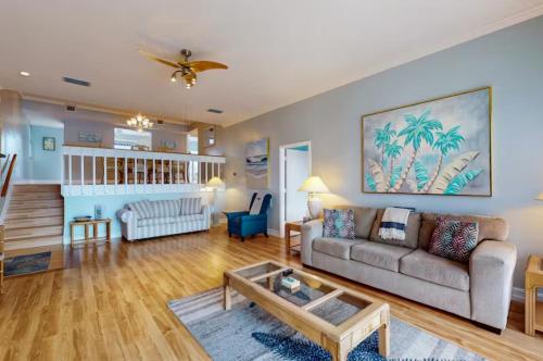 a living room with a couch and a coffee table at Our House at the Lake House C117 by Beachside in Siesta Key