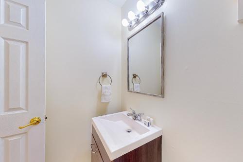 a bathroom with a sink and a mirror at Seascape in Myrtle Beach
