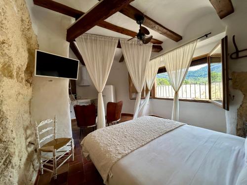 Ένα ή περισσότερα κρεβάτια σε δωμάτιο στο Authentic Cave House with Views - Cova L'Aljub