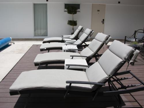 a row of chairs lined up in a room at Hotel St. George in Celaya
