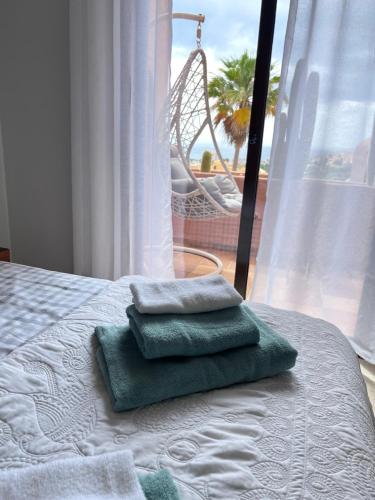 Postel nebo postele na pokoji v ubytování Oasis Coto Real apartments