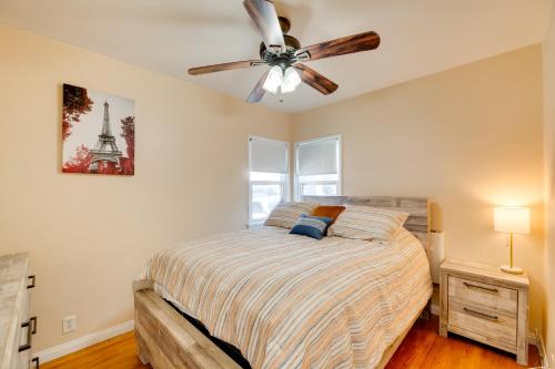 a bedroom with a bed with a ceiling fan at Walk to Sand and Surf - Bright Manhattan Beach Apt! in Manhattan Beach